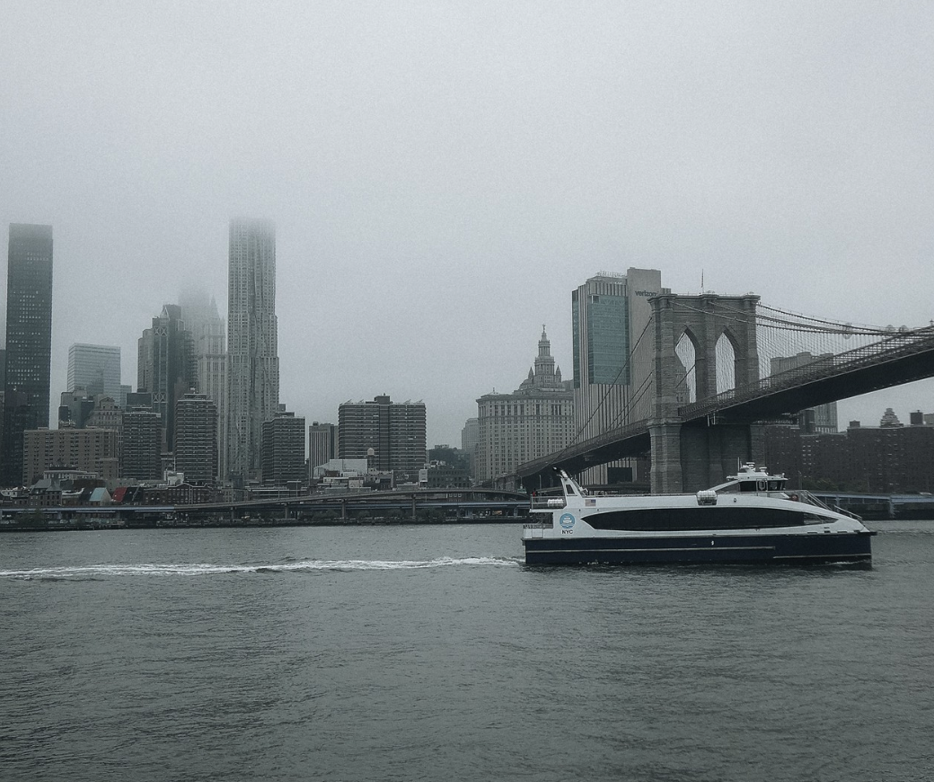 The Brooklyn Bridge viewed from a harbour cruise on the East River