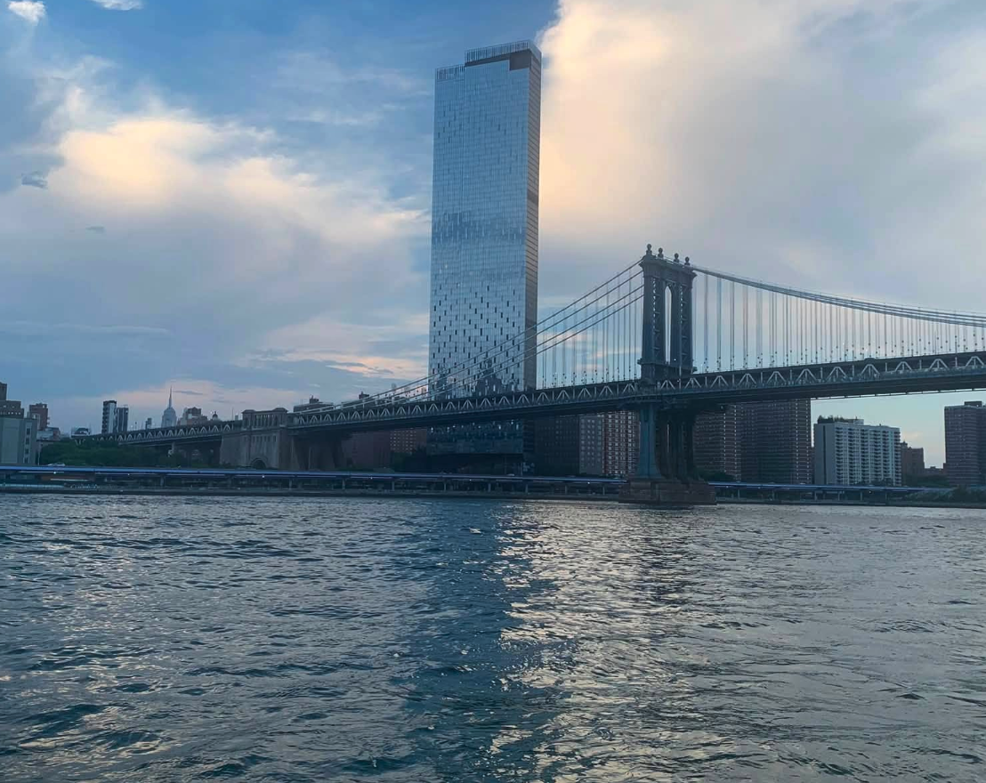 The Brooklyn Bridge with the Manhattan skyline behind it